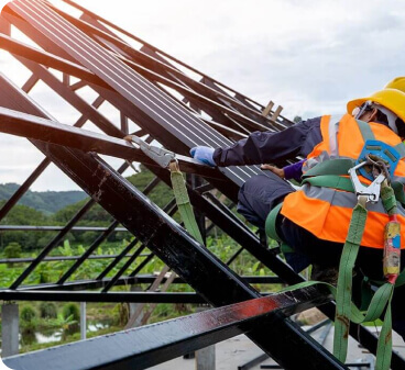 image of construction workers on a roof